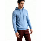 Man wearing light blue knit hooded sweater with maroon trousers, worn on model | Chaps London