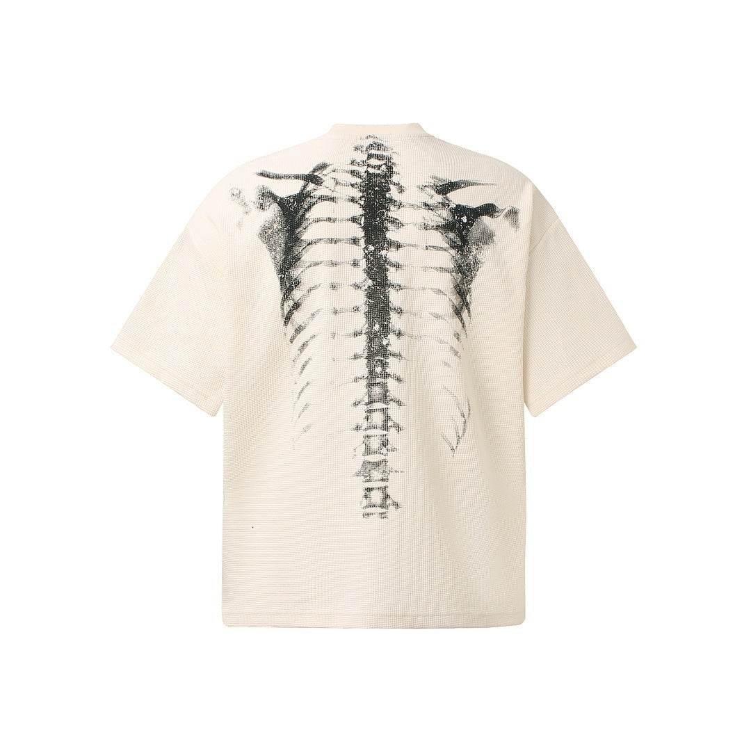 Cream oversized t-shirt with gray spine print, shown flat back view | Chaps London