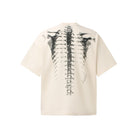 Cream oversized t-shirt with gray spine print, shown flat back view | Chaps London