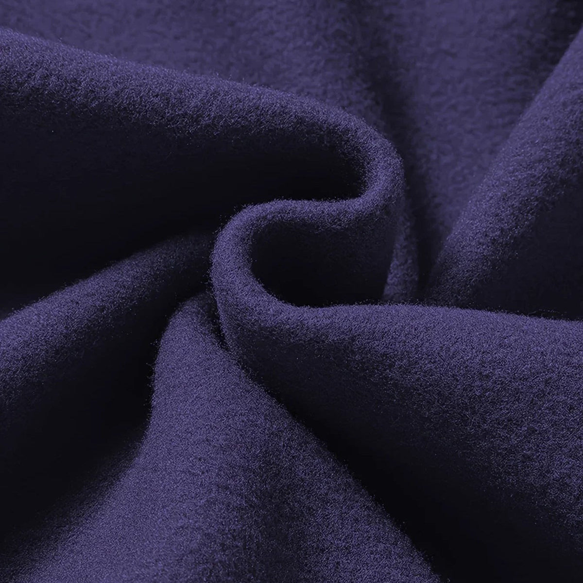 Close-up swirled navy blue fabric texture with soft folds and draping | Chaps London