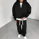 Black half-zip hoodie with white layered shirt, worn by man | Chaps London