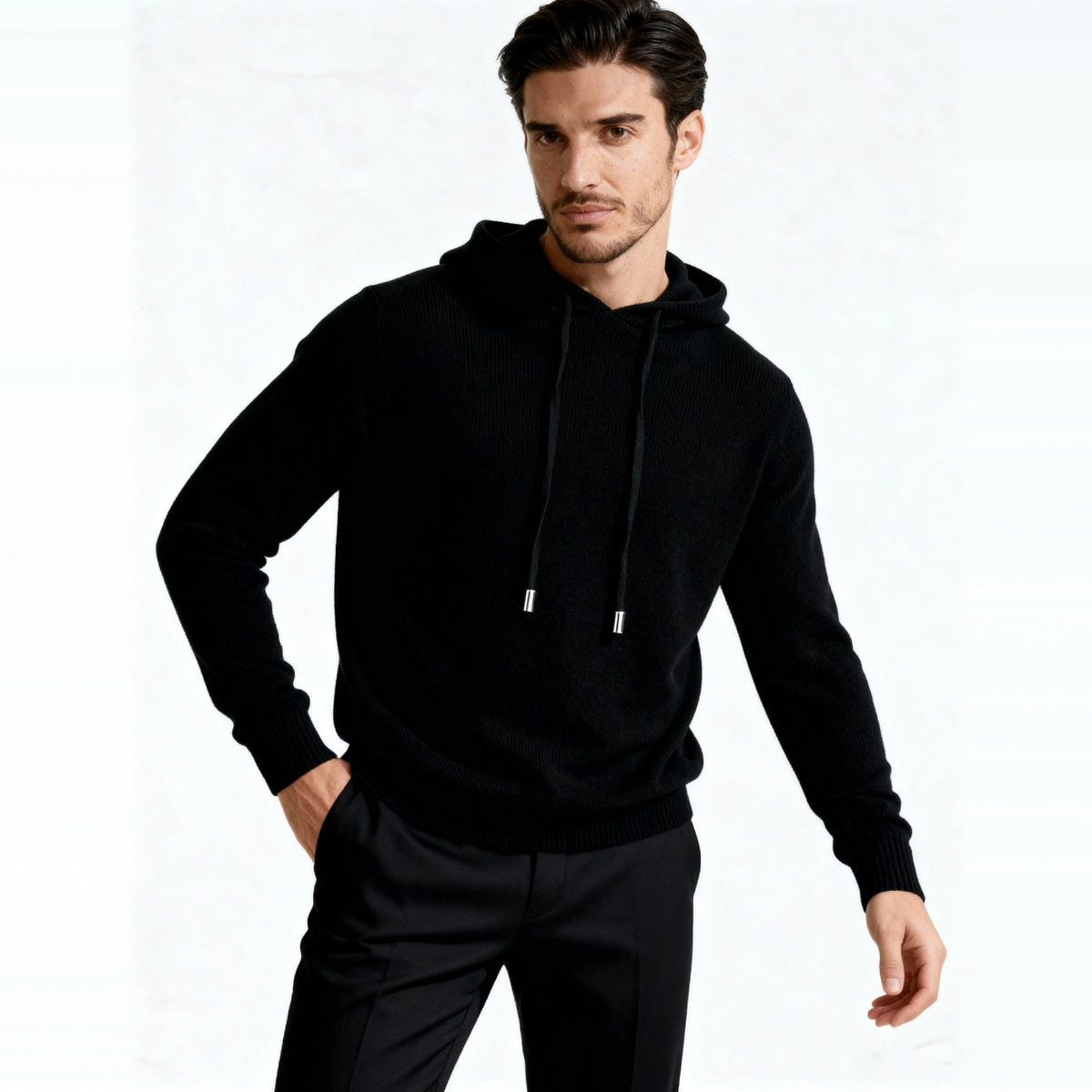 Man wearing black knit hoodie with drawstrings and black trousers | Chaps London