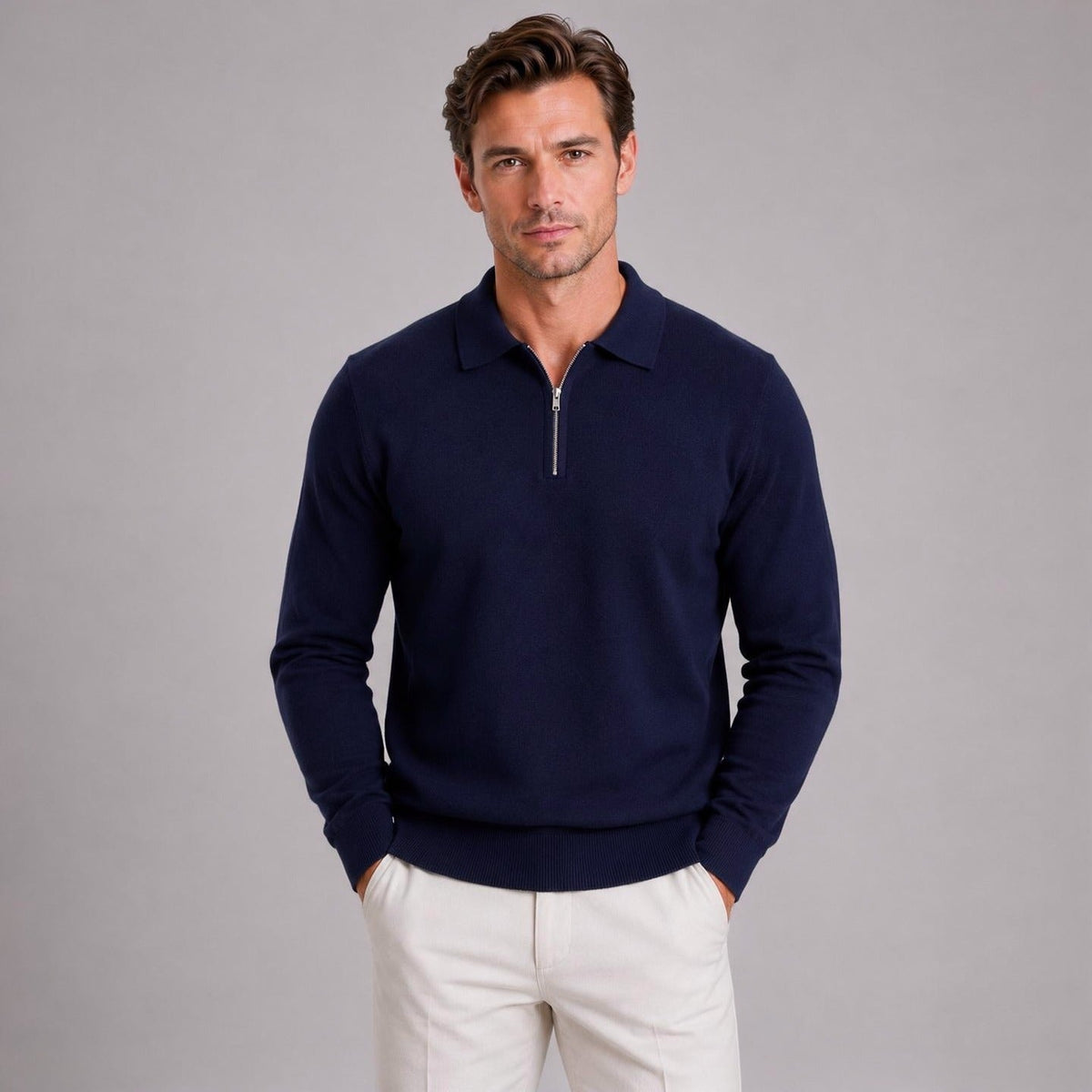 Man wearing navy quarter zip polo jumper with white trousers | Chaps London