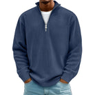 Man wearing navy blue ribbed knit half-zip sweater with light denim jeans | Chaps London