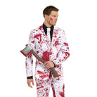 Man wearing white blood splatter suit with tie, holding toy axe | Chaps London