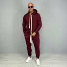 Man wearing burgundy hoodie tracksuit with matching cuffed joggers and white sneakers | Chaps London