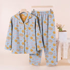 Blue pyjama set with pumpkin and ghost print, displayed on hanger | Chaps London