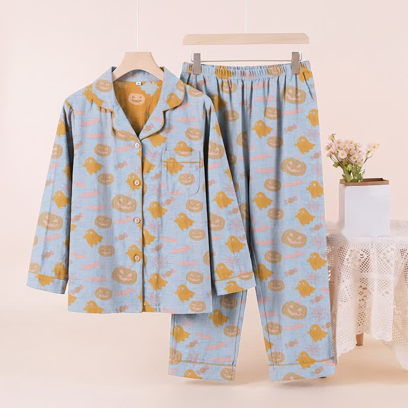 Blue pyjama set with pumpkin and ghost print, displayed on hanger | Chaps London
