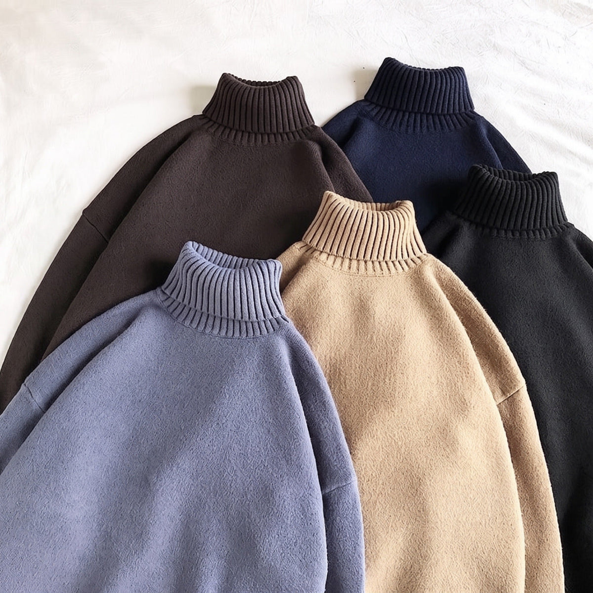 Five oversized roll neck sweaters in brown, navy, blue, tan, black, flat lay | Chaps London