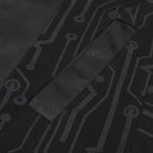 Close-up of black circuit print fabric with textured fabric panel detail | Chaps London