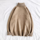 Beige knit turtleneck sweater with ribbed cuffs, laid flat on fabric | Chaps London
