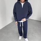Navy half-zip hoodie and wide-leg joggers worn by a man standing | Chaps London
