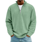 Man wearing sage green ribbed knit half-zip sweater with light denim jeans | Chaps London