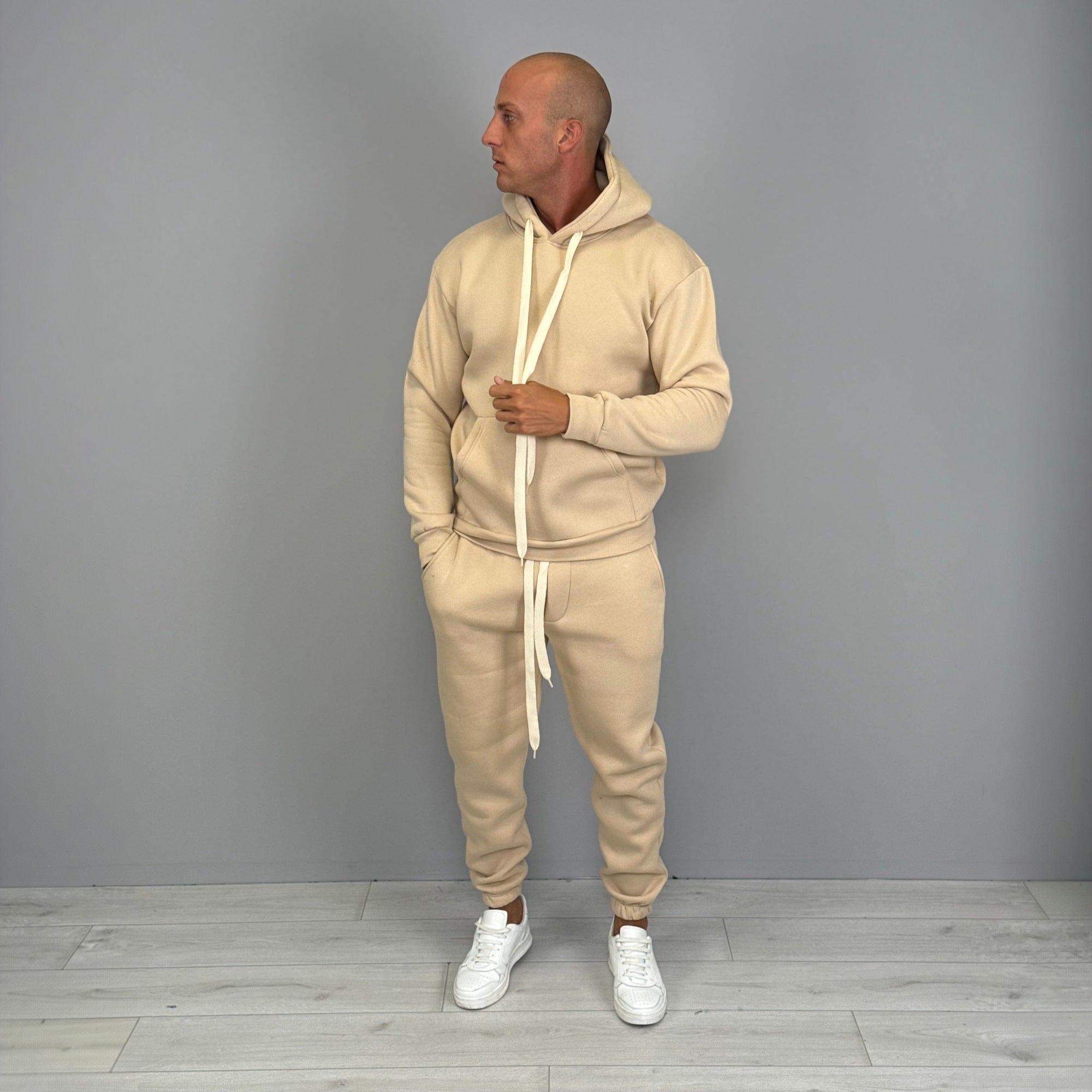 Man wearing beige hoodie and matching cuffed jogger tracksuit set | Chaps London