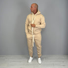 Man wearing beige hoodie and matching cuffed jogger tracksuit set | Chaps London
