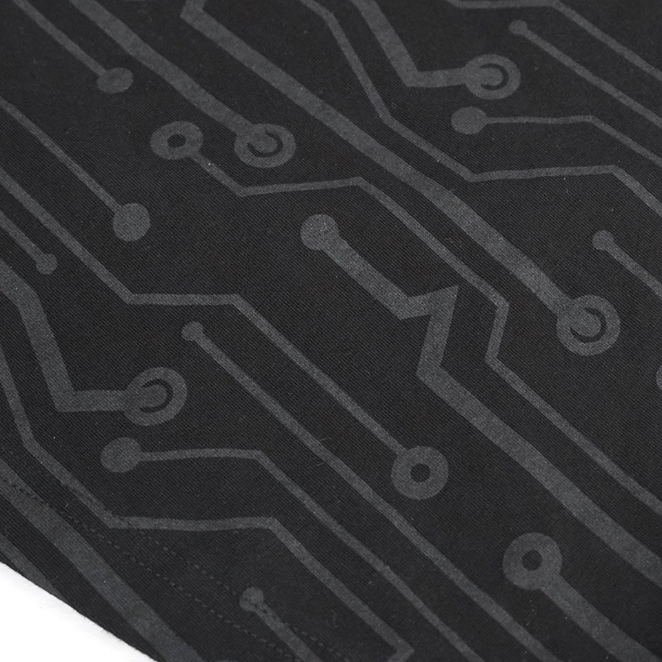 Close-up of black fabric with gray circuit board pattern design | Chaps London
