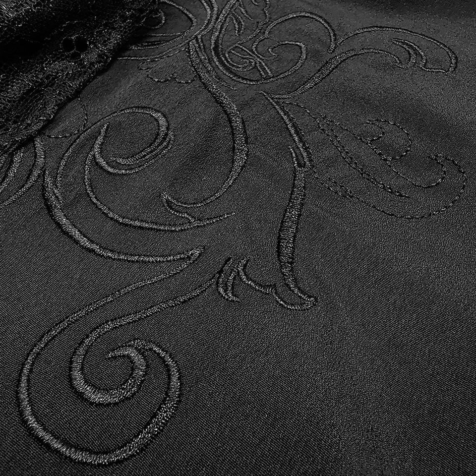 Black fabric with swirling embroidered pattern, flat close-up view | Chaps London