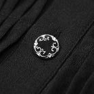 Black round button with ornate silver scrollwork design on pleated fabric | Chaps London