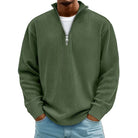 Man wearing olive green ribbed knit quarter-zip sweater with light jeans | Chaps London