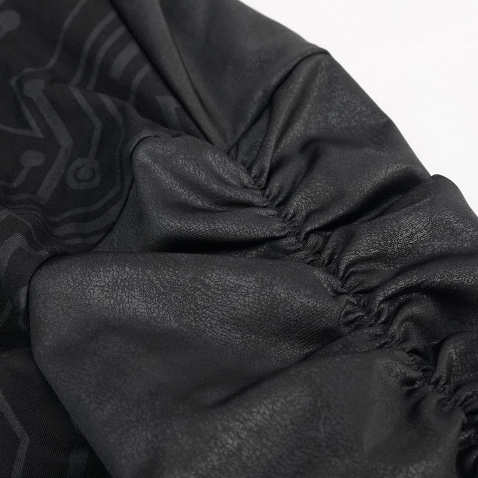 Close-up of black gathered elasticized cuff with subtle circuit pattern fabric | Chaps London