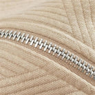 Close-up of beige ribbed knit fabric with silver half-zip closure | Chaps London