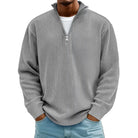 Man wearing gray ribbed knit half-zip sweater with light blue jeans | Chaps London