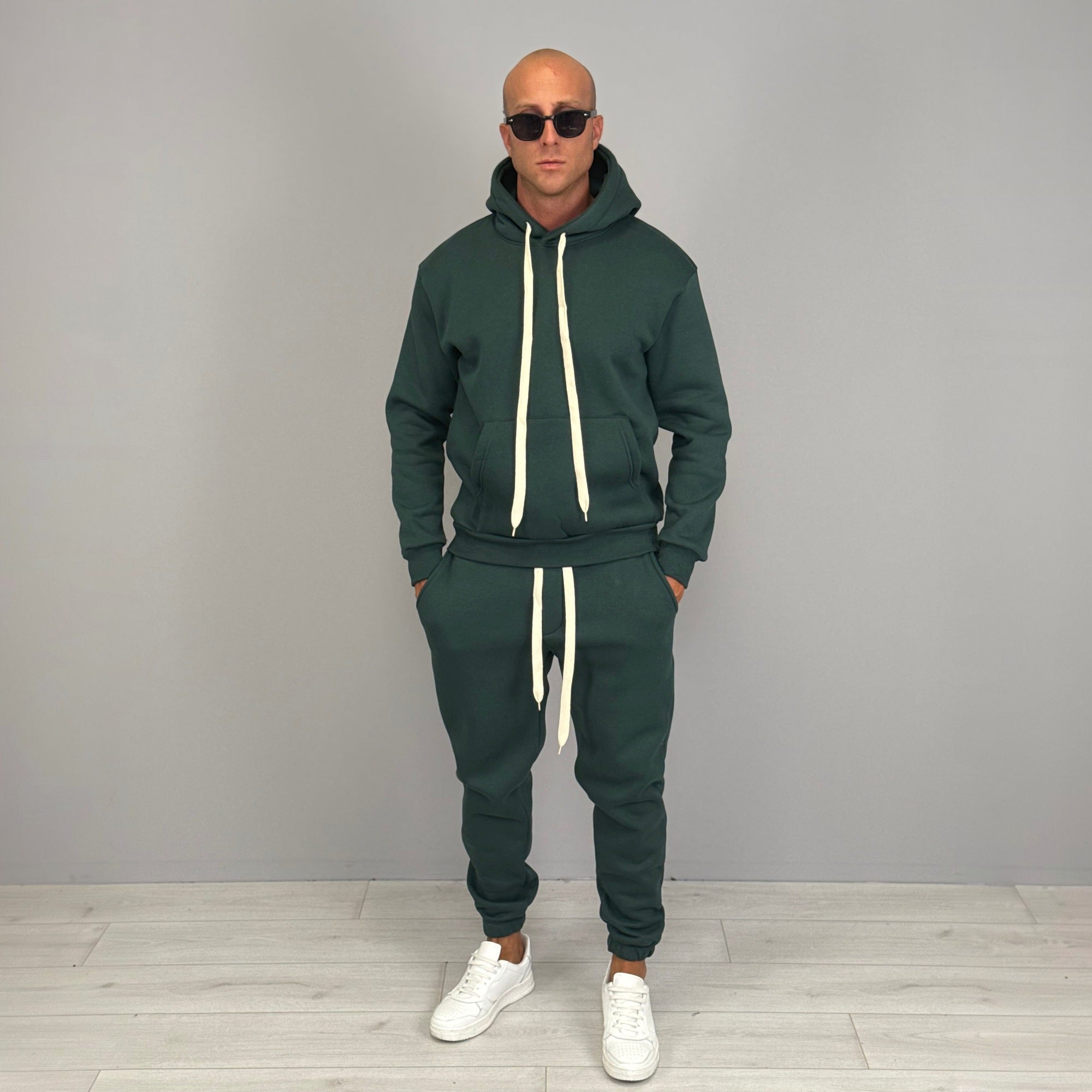 Man wearing dark green hoodie and matching jogger tracksuit outfit | Chaps London