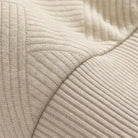 Close-up of beige ribbed knit fabric with textured diagonal stripe pattern | Chaps London