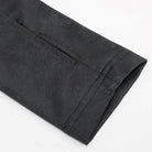 Black textured cuff close-up showing seam detail and welt pocket on sleeve | Chaps London