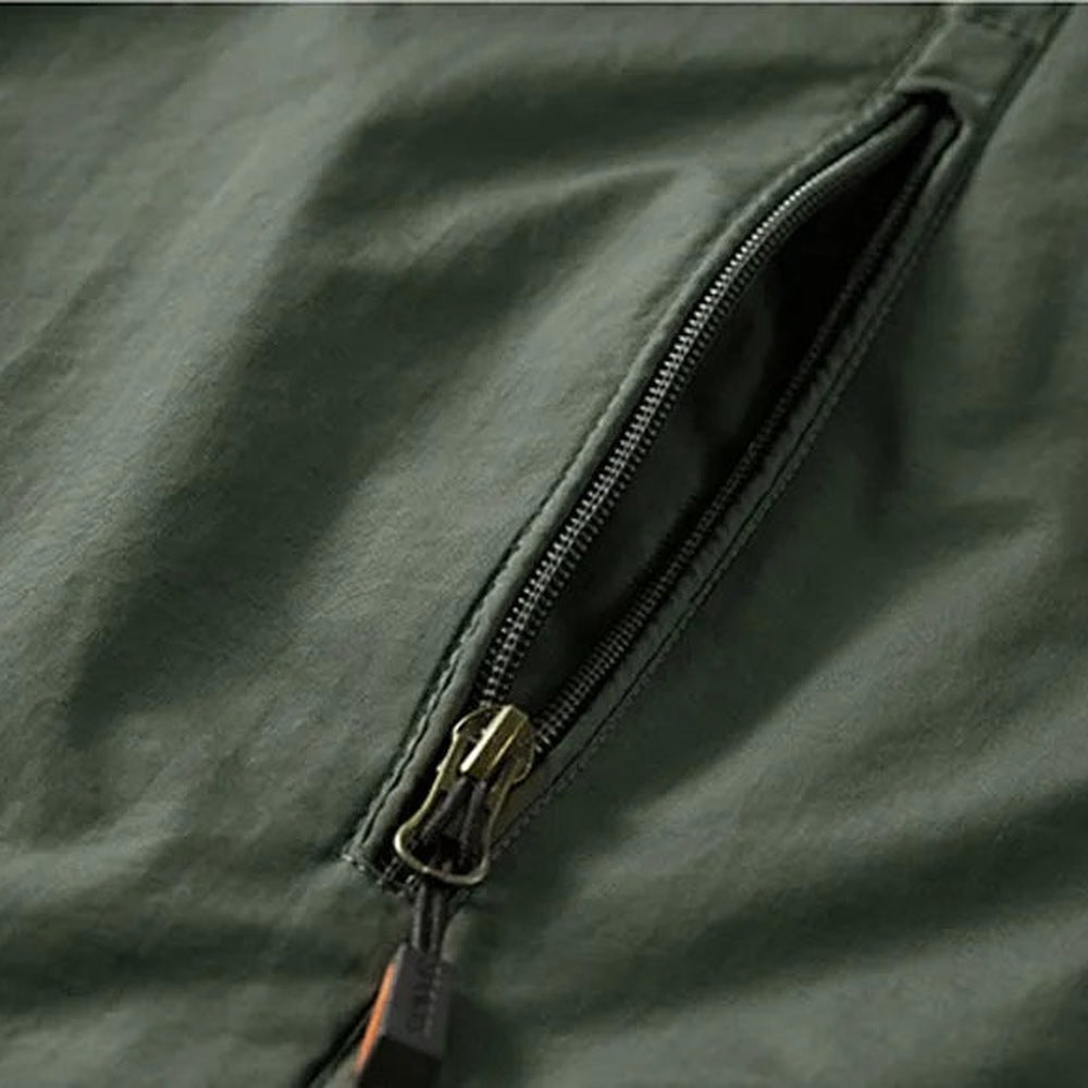 Close-up of dark green jacket zipper pocket with metal zipper pull | Chaps London