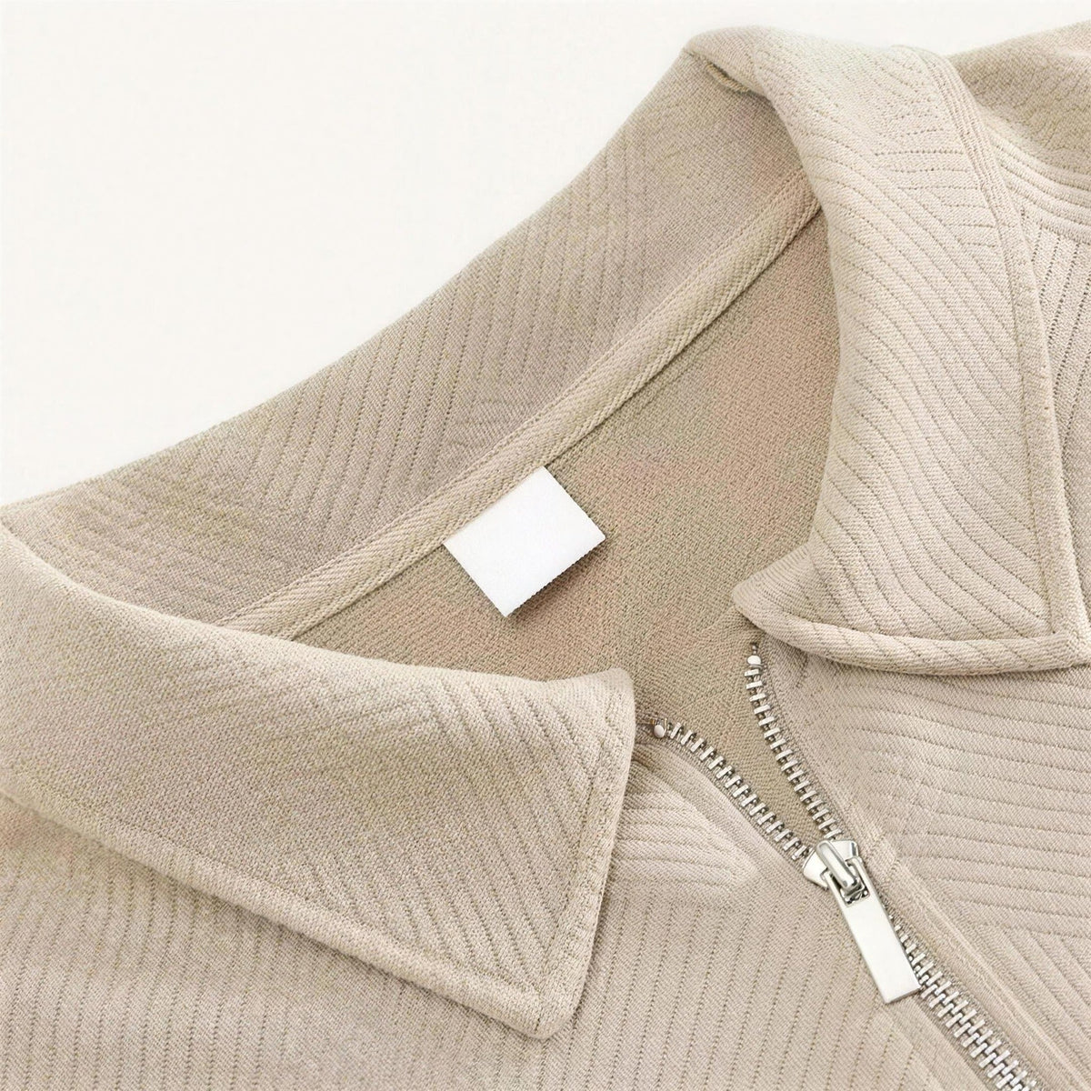 Beige textured knit polo collar with zipper detail, close-up worn shot | Chaps London