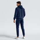 Man wearing navy zip hoodie and matching joggers, rear view, worn | Chaps London