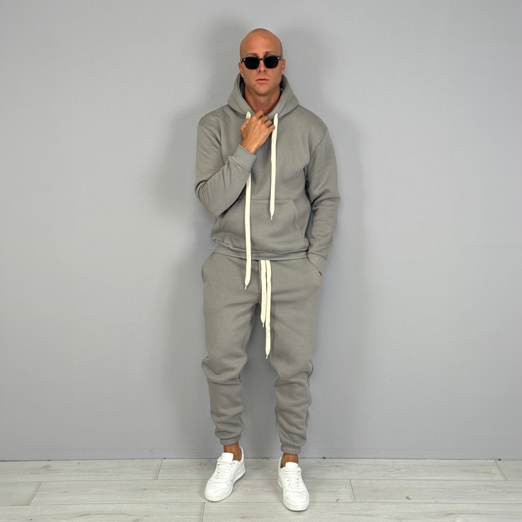 Man wearing grey hoodie and jogger tracksuit with white sneakers | Chaps London