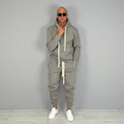 Man wearing grey hoodie and jogger tracksuit with white sneakers | Chaps London