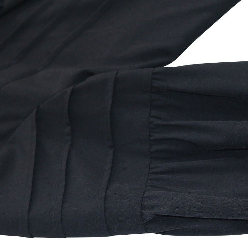 Black ruffled cuff detail with pleated gathered fabric shown flat, close-up | Chaps London