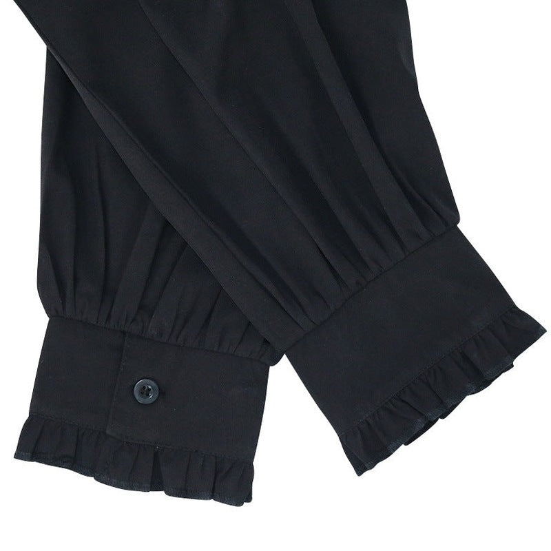 Black ruffled cuffs with buttons on sleeves, close-up worn view | Chaps London