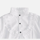 White ruffled shirt with stand collar, black buttons, worn by person | Chaps London