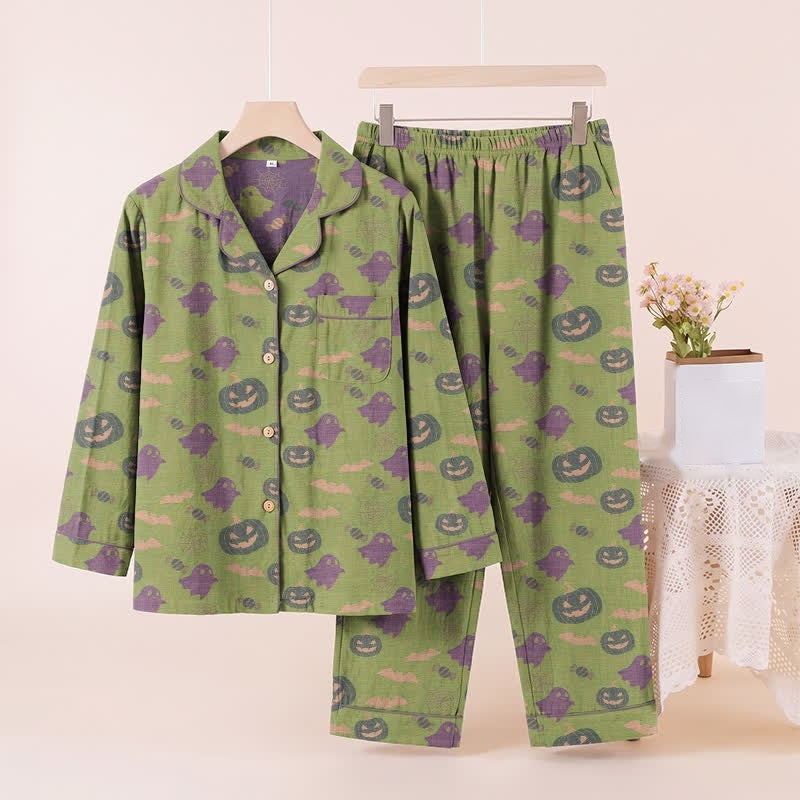 Green pyjama set with ghost and pumpkin print, displayed on hanger | Chaps London