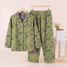 Green pyjama set with ghost and pumpkin print, displayed on hanger | Chaps London