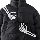 Black puffer jacket worn by person with skeleton hand graphic details | Chaps London