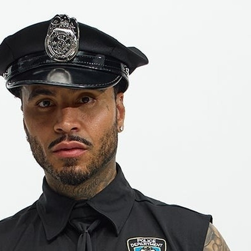 Man wearing black police costume with hat, badge, and tie | Chaps London