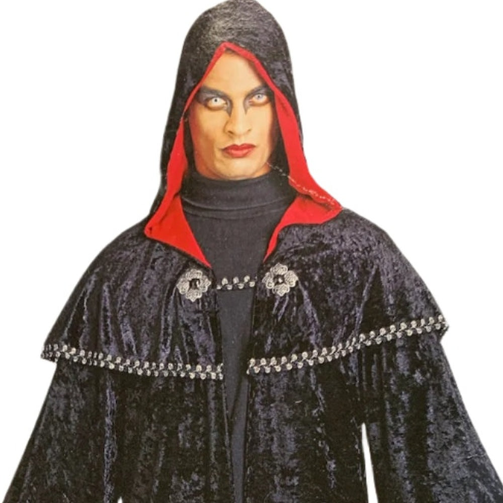 Man wearing black hooded cape with red lining and silver trim | Chaps London