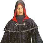 Man wearing black hooded cape with red lining and silver trim | Chaps London