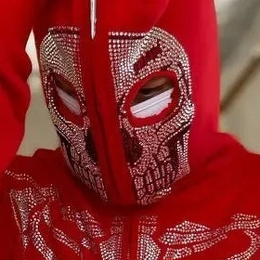 Red rhinestone skull mask hoodie worn by person, zipped up over face | Chaps London