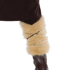 Tan faux fur arm covers worn on leg with brown boot | Chaps London