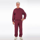 Older man wearing burgundy fleece tracksuit, crew neck sweatshirt and joggers, smiling | Chaps London