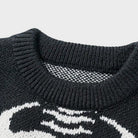 Close-up of black crew neck sweater with skeleton graphic pattern | Chaps London