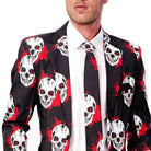 Man wearing black skull print blazer with red splatter pattern and tie | Chaps London