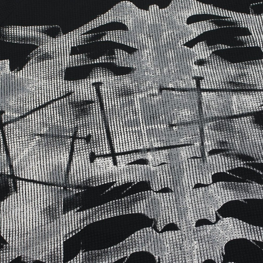Close-up of black and white abstract print fabric with waffle texture | Chaps London