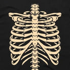 Black t-shirt with tan skeleton ribcage print, close-up fabric view | Chaps London